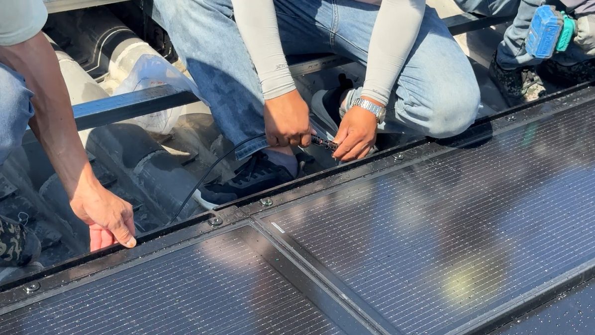 Matte-black BIPV solar roof tiles